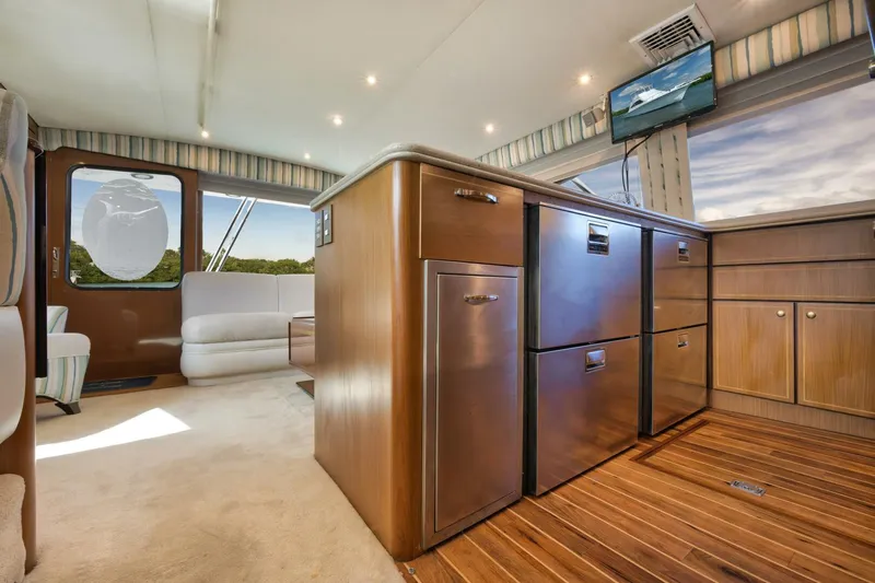 Mullet Yacht Photos Pics Interior of 2006 Ocean Yachts 50 Super Sport with modern kitchen and seating area.