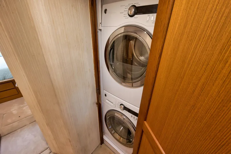 Mullet Yacht Photos Pics Stacked washer and dryer in 2006 Ocean Yachts 50 Super Sport interior.