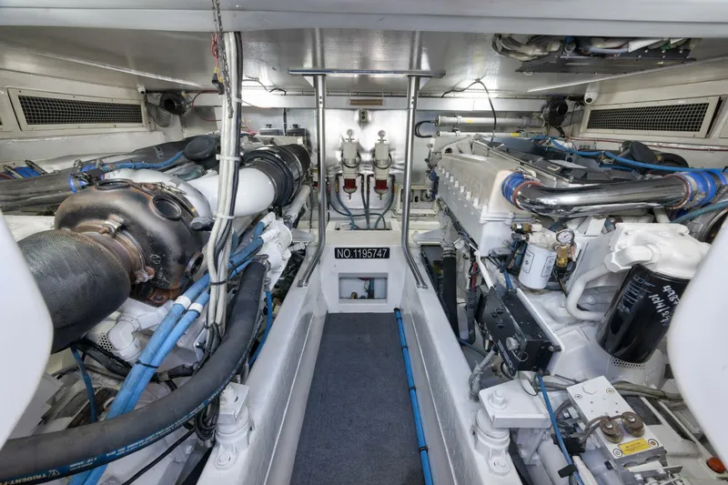 Mullet Yacht Photos Pics Engine room of 2006 Ocean Yachts 50 Super Sport, showcasing dual engines and mechanical systems.