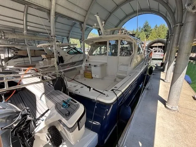  Yacht Photos Pics 2007 Glacier Bay 3480 Ocean Runner docked in a covered marina.
