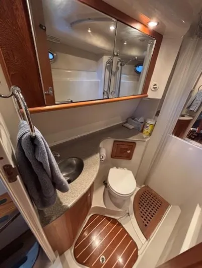  Yacht Photos Pics 2007 Glacier Bay 3480 Ocean Runner bathroom with sink, toilet, and shower.