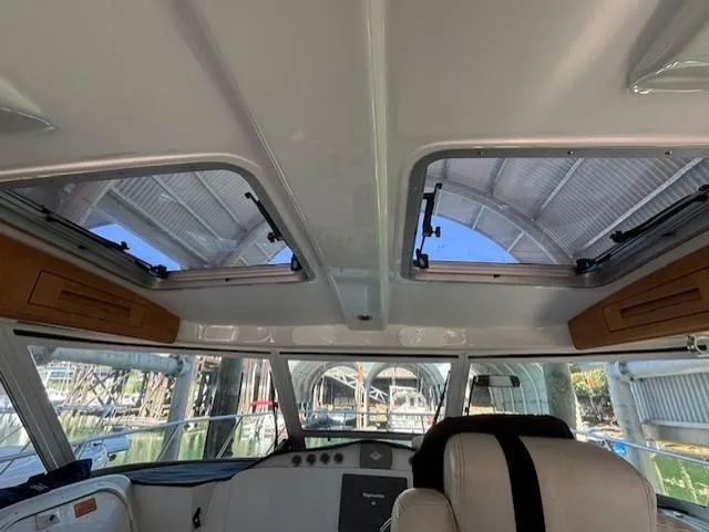  Yacht Photos Pics Interior view of 2007 Glacier Bay 3480 Ocean Runner boat with sunroof and seating.