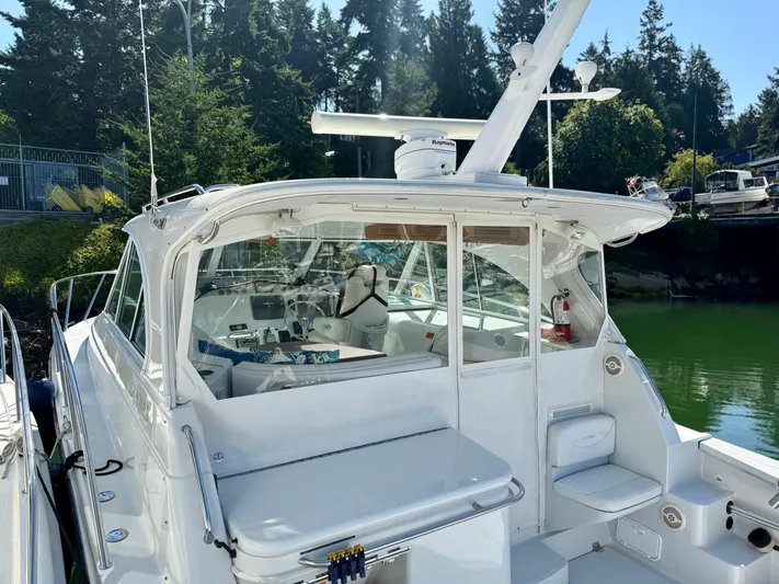  Yacht Photos Pics 2007 Glacier Bay 3480 Ocean Runner boat docked, featuring a spacious cockpit and modern equipment.