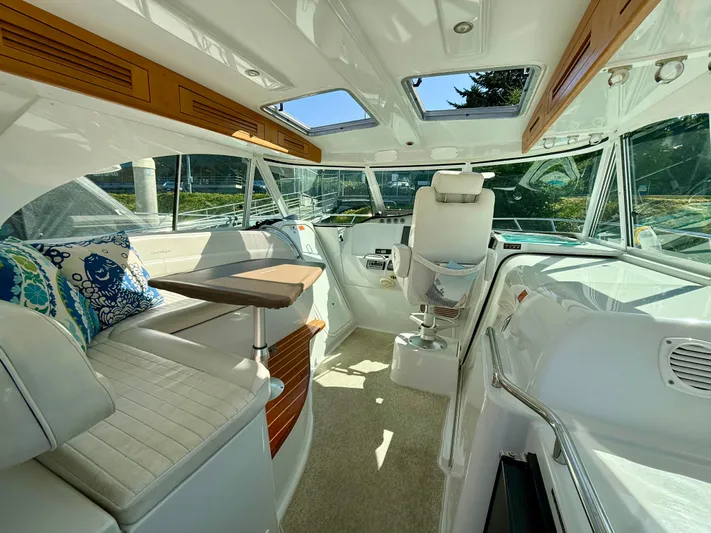  Yacht Photos Pics Interior of 2007 Glacier Bay 3480 Ocean Runner, featuring seating and helm station.