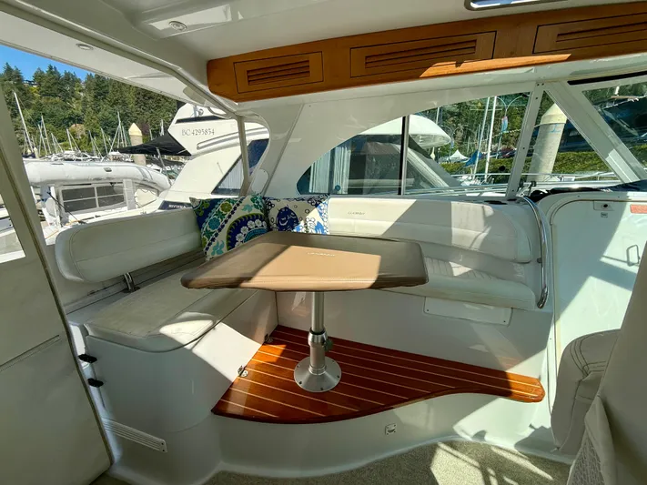  Yacht Photos Pics Interior of 2007 Glacier Bay 3480 Ocean Runner with seating and table, docked at marina.