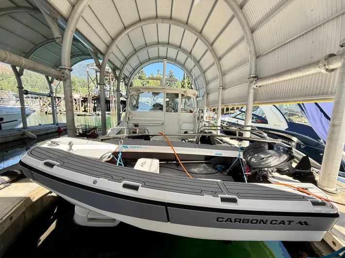  Yacht Photos Pics 2007 Glacier Bay 3480 Ocean Runner boat docked under a covered marina.