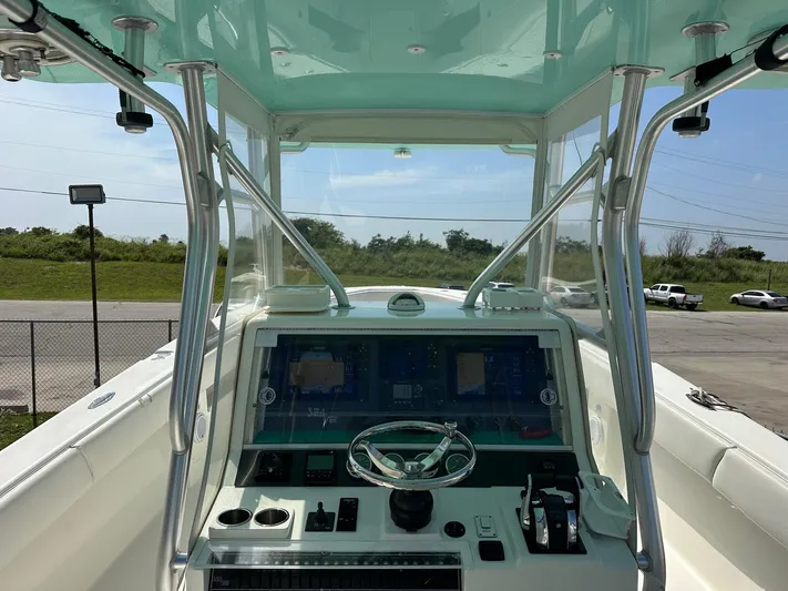  Yacht Photos Pics 2013 SeaVee 390B boat helm with modern controls and steering wheel.