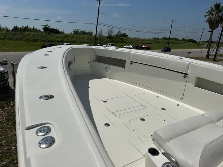  Yacht Photos Pics 2013 SeaVee 390B boat deck with seating and storage compartments.