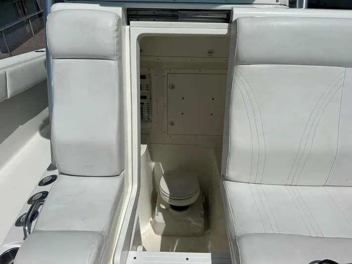  Yacht Photos Pics 2013 SeaVee 390B boat interior with white seating and hidden compartment.