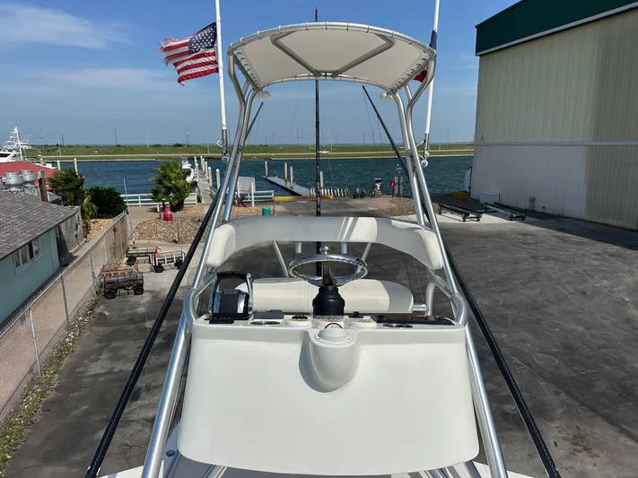  Yacht Photos Pics 2013 SeaVee 390B boat helm with American flag, dockside view.