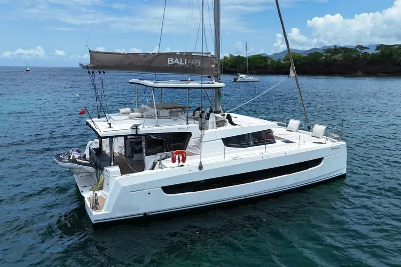 My Marina Yacht Photos Pics 2020 Bali 4.8 catamaran sailing on clear blue waters, featuring spacious deck and modern design.