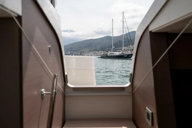 My Marina Yacht Photos Pics View from Bali 4.8 yacht, 2020 model, overlooking serene harbor and distant mountains.