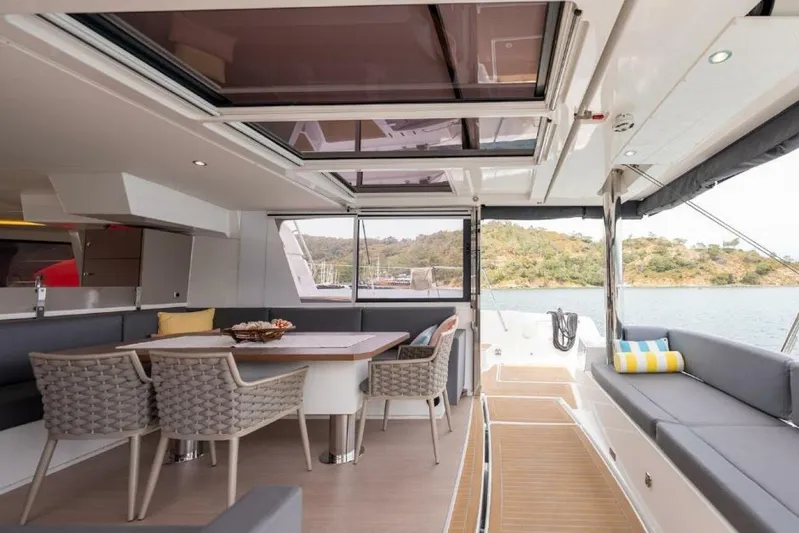 My Marina Yacht Photos Pics Luxurious 2020 Bali 4.8 yacht interior with dining area and scenic water view.