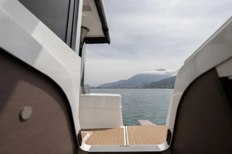 My Marina Yacht Photos Pics View from a 2020 Bali 4.8 yacht, overlooking serene waters and distant mountains.