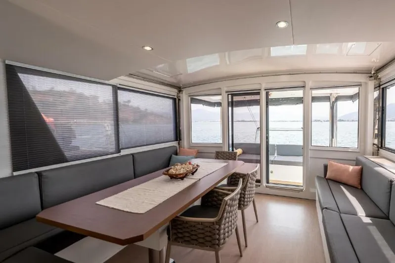 My Marina Yacht Photos Pics Luxurious interior of 2020 Bali 4.8 yacht with spacious seating and ocean view.