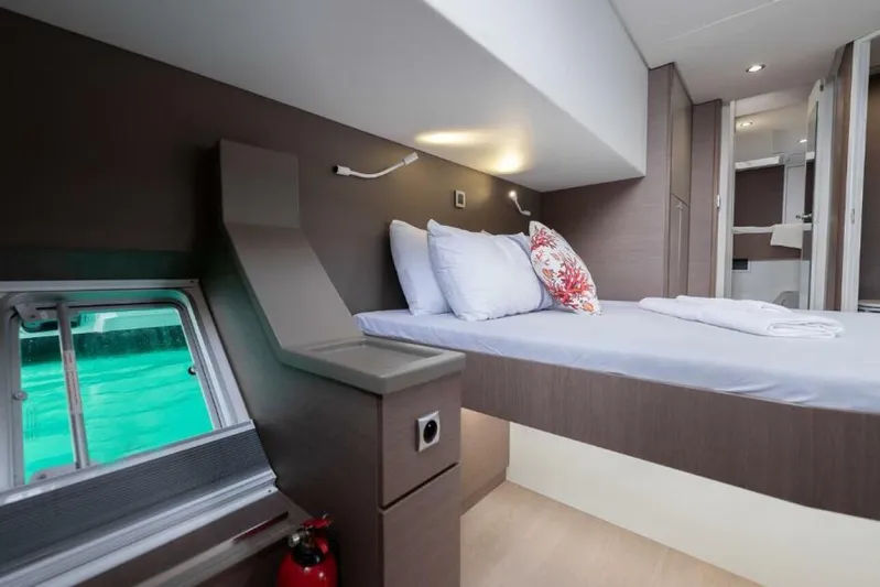 My Marina Yacht Photos Pics Modern cabin interior of 2020 Bali 4.8 yacht with bed and window view.