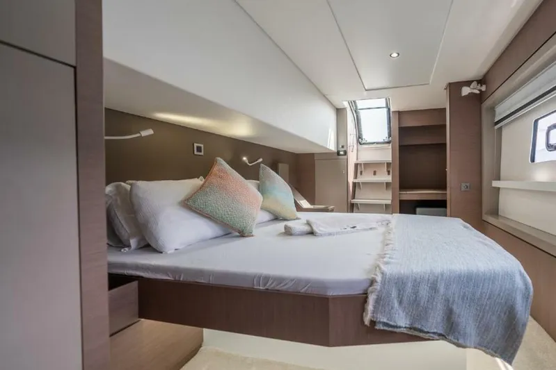 My Marina Yacht Photos Pics Luxurious interior of 2020 Bali 4.8 yacht cabin with cozy bedding and modern design.