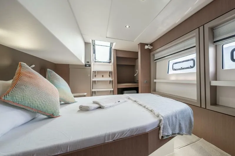 My Marina Yacht Photos Pics Luxurious cabin interior of 2020 Bali 4.8 yacht with cozy bedding and modern design.
