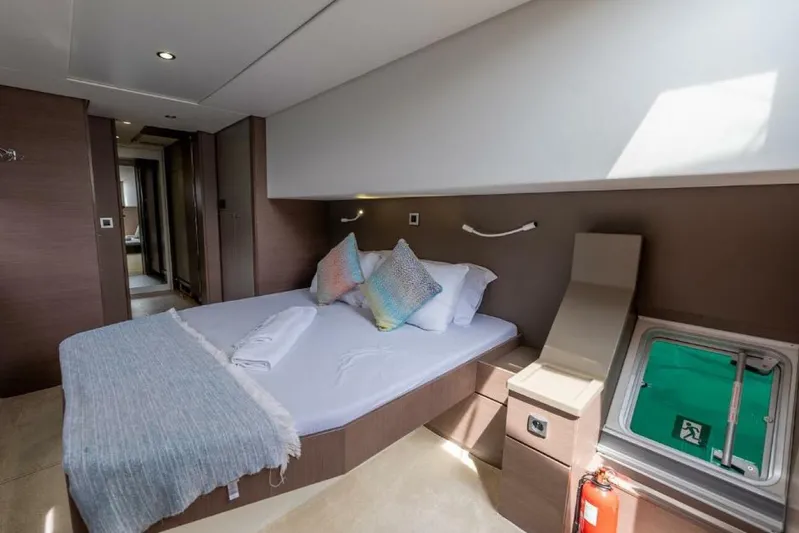 My Marina Yacht Photos Pics Luxurious cabin interior of 2020 Bali 4.8 yacht with modern design and cozy bedding.