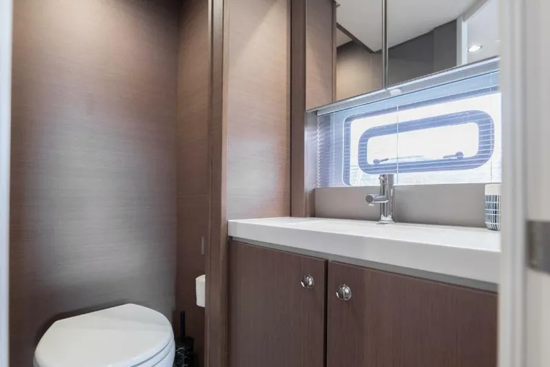 My Marina Yacht Photos Pics Modern yacht bathroom with sleek wood cabinetry, sink, and window. Bali 4.8, 2020 model.