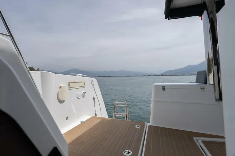 My Marina Yacht Photos Pics Bali 4.8 yacht deck overlooking serene ocean and distant mountains, 2020 model.
