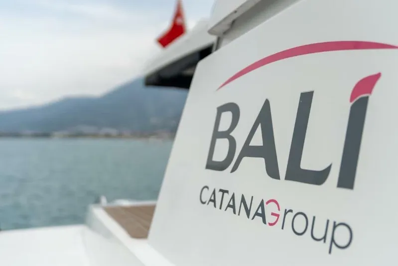 My Marina Yacht Photos Pics Bali 4.8 catamaran by Catana Group, 2020 model, docked with scenic mountain backdrop.