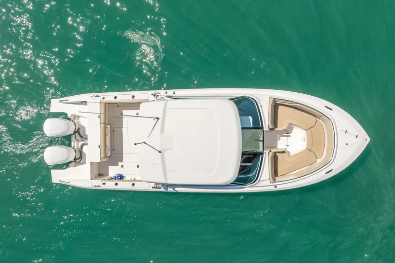 Waikiki Yacht Photos Pics Overhead view of 2017 Pursuit DC 325 Dual Console boat on turquoise water.