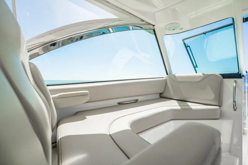 Waikiki Yacht Photos Pics 2017 Pursuit DC 325 Dual Console interior with sleek seating and ocean view.