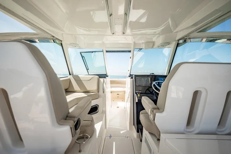 Waikiki Yacht Photos Pics 2017 Pursuit DC 325 Dual Console interior with modern seating and navigation controls.