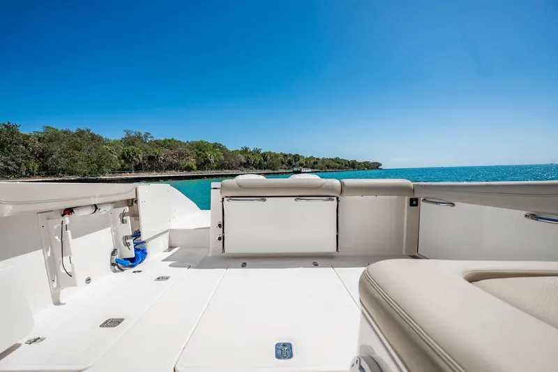 Waikiki Yacht Photos Pics 2017 Pursuit DC 325 Dual Console boat interior with ocean view and clear blue sky.