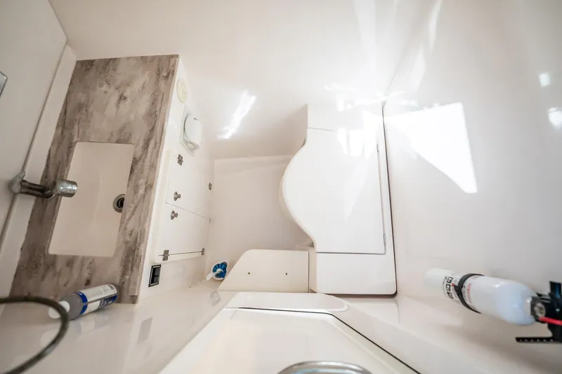 Waikiki Yacht Photos Pics 2017 Pursuit DC 325 Dual Console interior with sink and storage compartments.