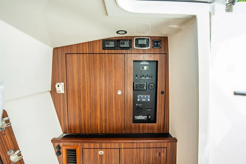 Waikiki Yacht Photos Pics 2017 Pursuit DC 325 Dual Console interior control panel with wood finish.