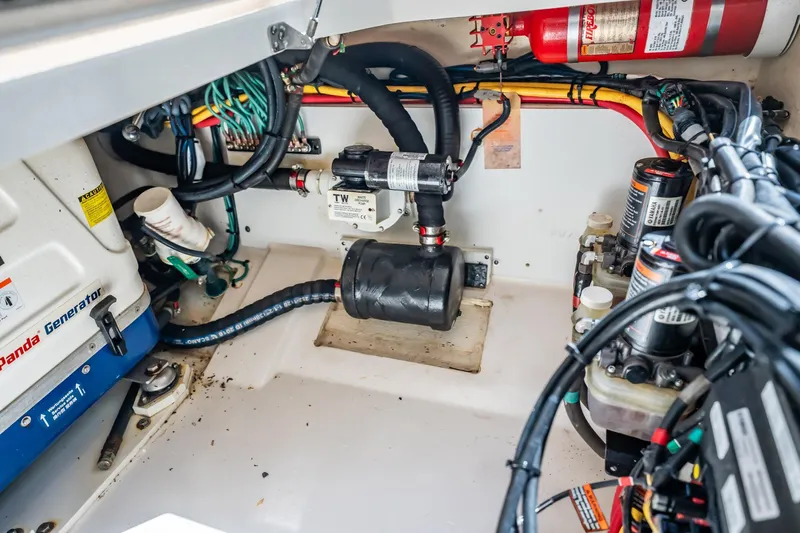 Waikiki Yacht Photos Pics Engine compartment of a 2017 Pursuit DC 325 Dual Console with generator and wiring.