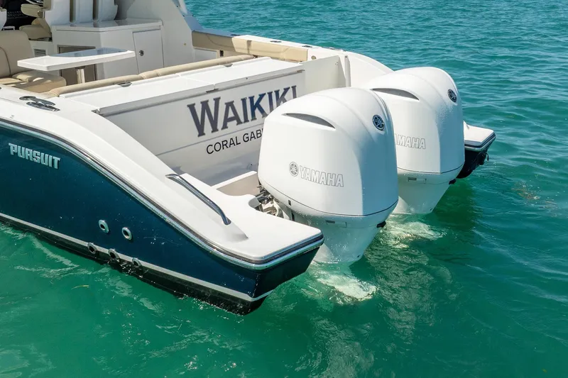 Waikiki Yacht Photos Pics 2017 Pursuit DC 325 Dual Console boat with twin Yamaha outboard engines on water.