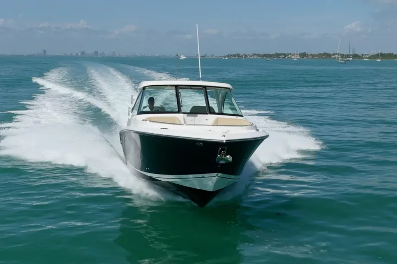 Waikiki Yacht Photos Pics 2017 Pursuit DC 325 Dual Console boat cruising on open water.