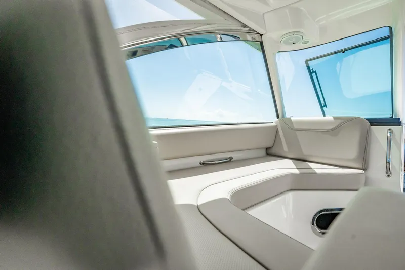 Waikiki Yacht Photos Pics Interior view of 2017 Pursuit DC 325 Dual Console boat with cushioned seating.