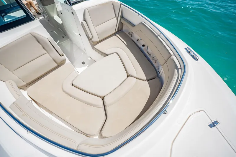 Waikiki Yacht Photos Pics 2017 Pursuit DC 325 Dual Console boat with spacious seating and sleek design on turquoise water.