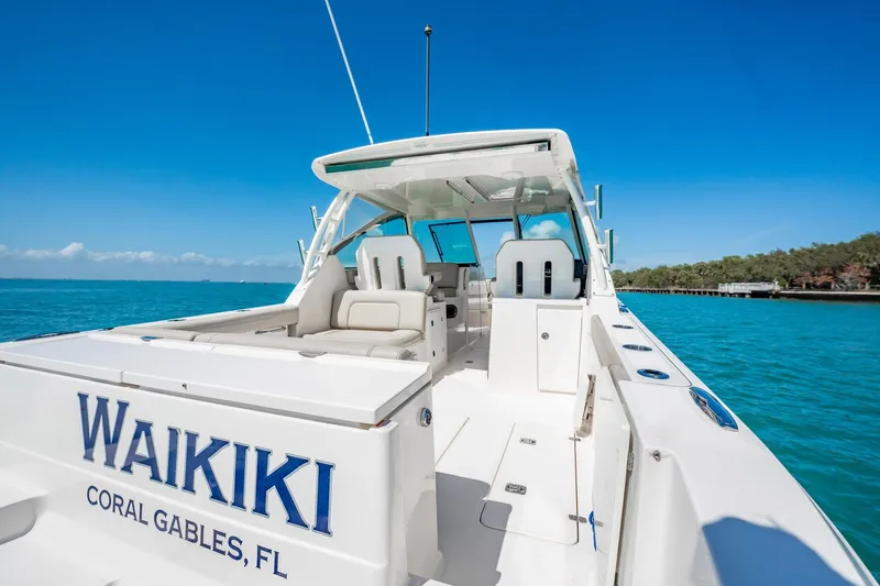 Waikiki Yacht Photos Pics 2017 Pursuit DC 325 Dual Console boat on clear blue water, Coral Gables, FL.