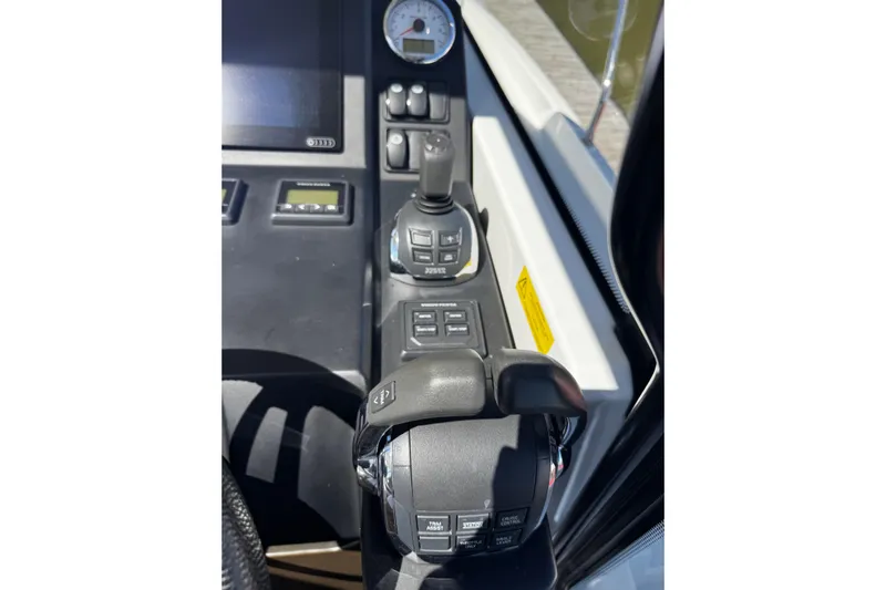  Yacht Photos Pics Control panel of 2019 Jeanneau NC33 boat with joystick and throttle.