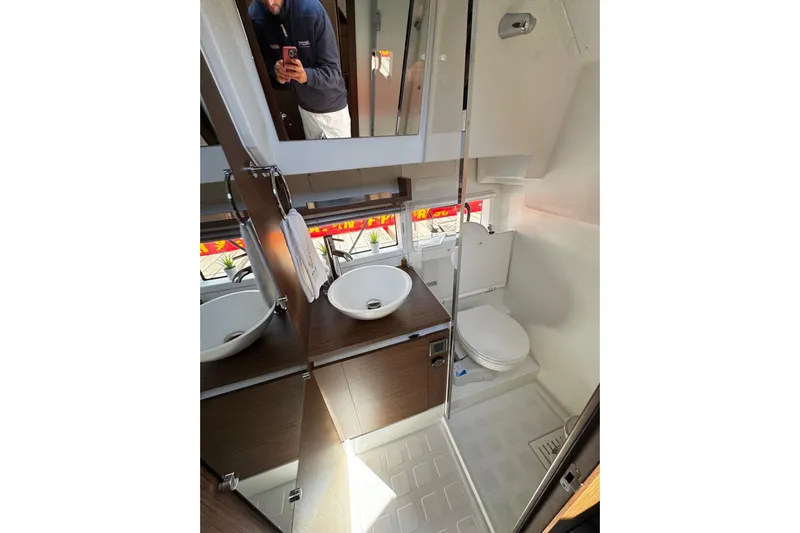  Yacht Photos Pics Bathroom interior of 2019 Jeanneau NC33 yacht, featuring modern fixtures and sleek design.