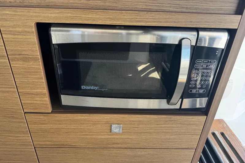  Yacht Photos Pics Built-in Danby microwave in 2019 Jeanneau NC33 yacht kitchen.