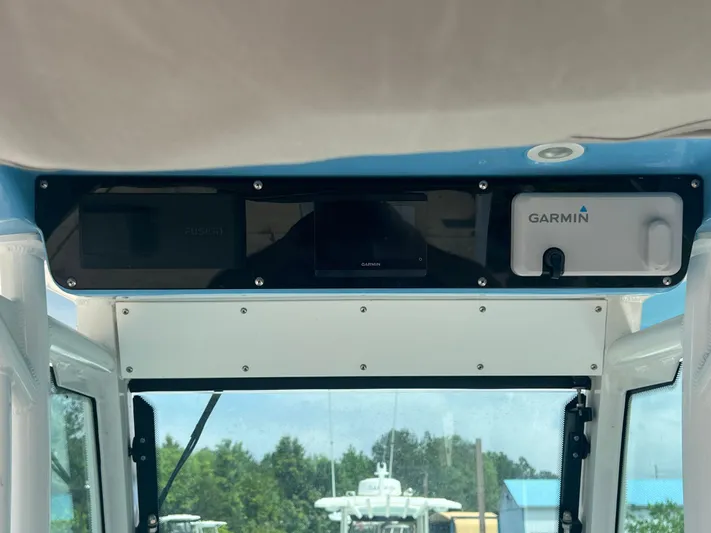  Yacht Photos Pics Everglades 253 CC 2023 boat dashboard with Garmin navigation system.