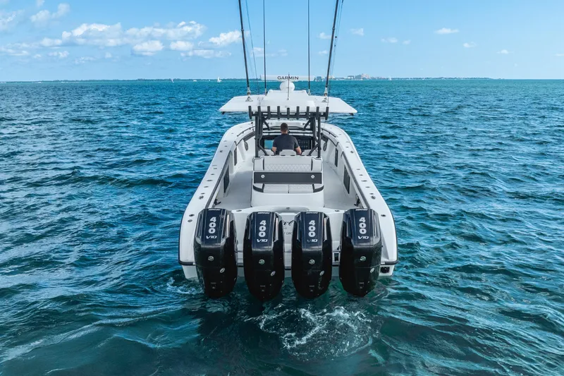  Yacht Photos Pics 2024 Yellowfin 39 Offshore boat with four powerful engines cruising on open water.