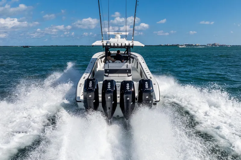  Yacht Photos Pics 2024 Yellowfin 39 Offshore boat speeding on open water with powerful engines.