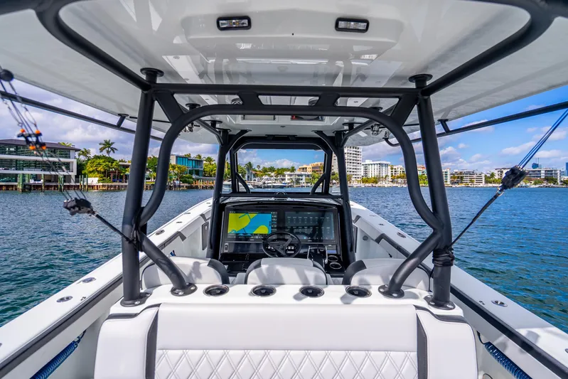  Yacht Photos Pics 2024 Yellowfin 39 Offshore boat interior with modern navigation system on a sunny day.