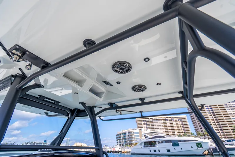  Yacht Photos Pics 2024 Yellowfin 39 Offshore boat with sleek T-top and marina view.