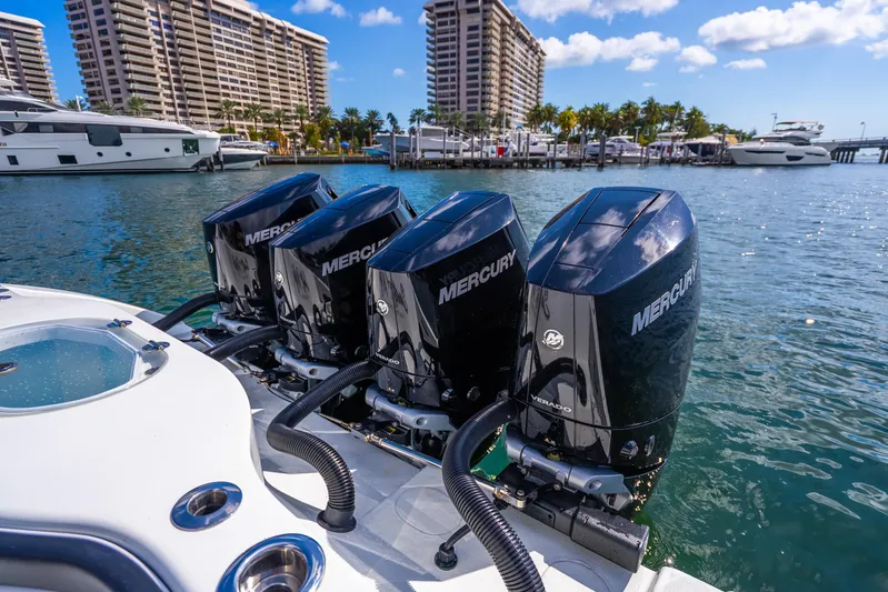  Yacht Photos Pics 2024 Yellowfin 39 Offshore with four Mercury outboard engines docked in a marina.