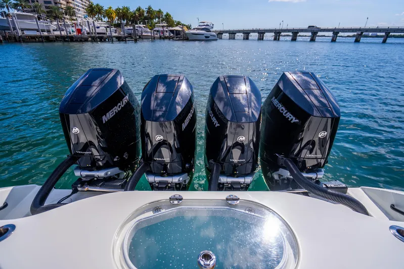  Yacht Photos Pics 2024 Yellowfin 39 Offshore boat with four Mercury Verado engines docked by the water.