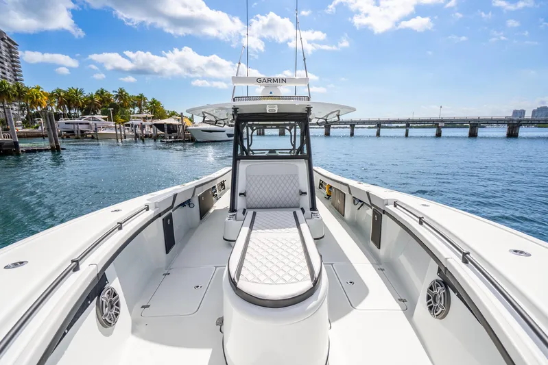  Yacht Photos Pics 2024 Yellowfin 39 Offshore boat on water, featuring sleek design and spacious deck.