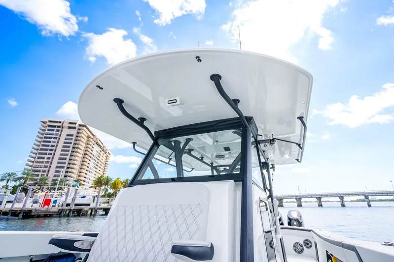  Yacht Photos Pics 2024 Yellowfin 39 Offshore boat docked, showcasing sleek design under a clear blue sky.